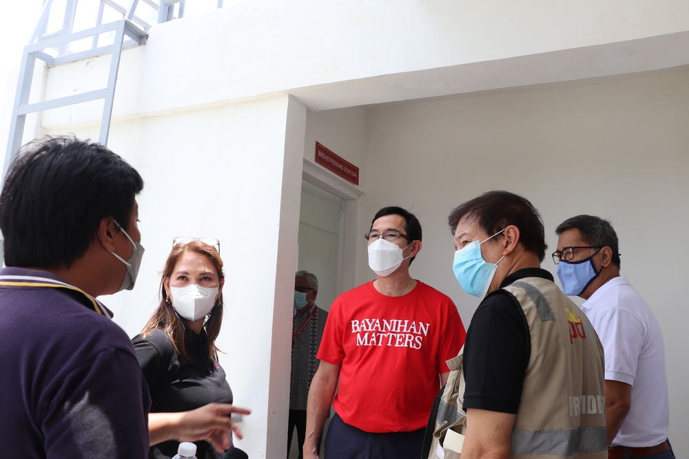 A group of people giving consultations